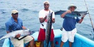 three men catch decent size wahoo's while on vacation in panama