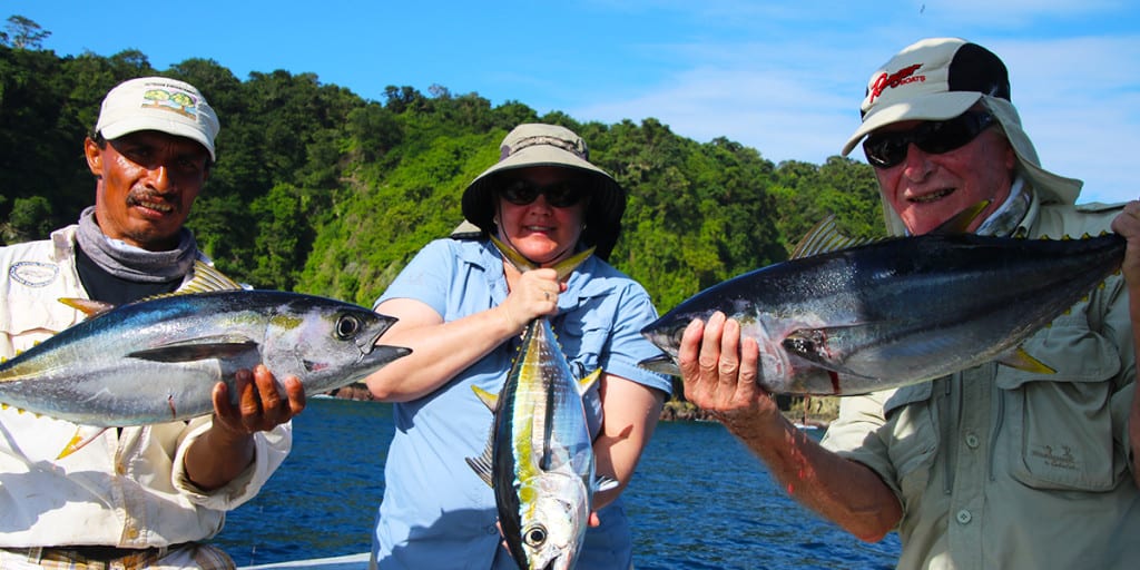 couple fishes near shore and scores with a bunch of fun football sized tuna