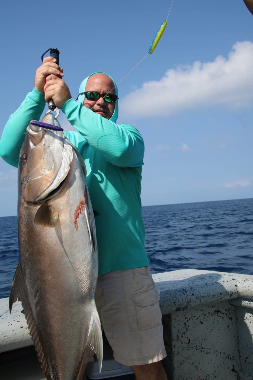 Josh with one of his amber jack fishing in panama