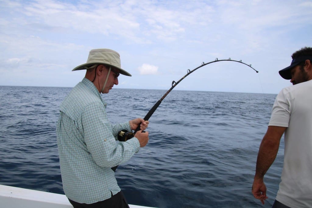gary hooked up to a big wahoo fishing in Pamama