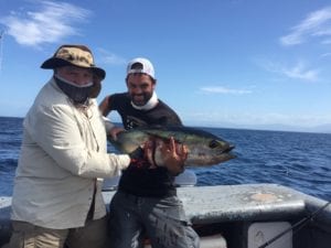 captain alex and guest with yellowfin tuna caught while visiting panama fishing lodge