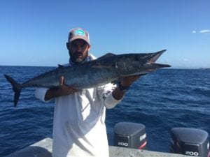 captain alex with a nice and rare wahoo caught while on a panama fishing charter near coiba island panama