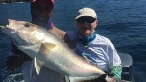 captain miguel with amber jack caught with guest visiting panama fishing lodge