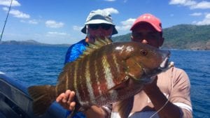 captain miguel with guest and a nice rock snapper caught inshore fishing panama near coiba island during dry season