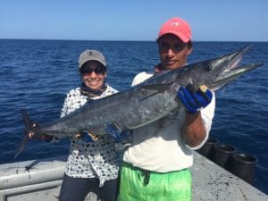captain miguel with lady angler who caught nice wahoo while on panama fishing vacation
