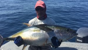 captain miguel with nice size tuna while on a panama fishing charter during dry season fishing island coiba