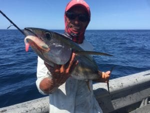 captain miguel with small tuna caught inshore fishing the tuna coast of panama