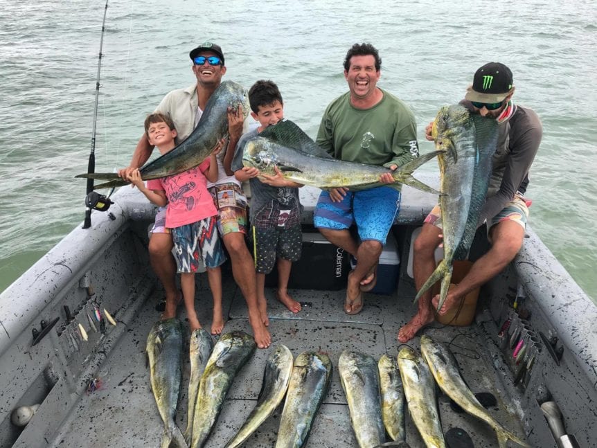 group posing with their catch of dorado on a panama fishing vacation