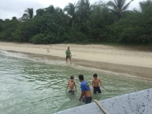 group-takes-a-break-to-fish-from-shore-while-in-Coiba-Island-on-panama-fishing-vacation