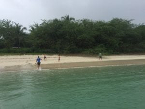 group takes break from the boat to fish from shore while at fishing Coiba Island Panama