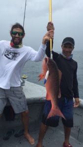 guest catches dog tooth snapper on fishing vacation