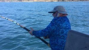 guest hooked up reeling in something big while on panama fishing vacation