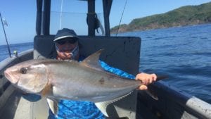 guest with amberjack caught inshore fishing while on panama fishing vacation