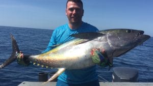 guest with his tuna caught while fishing near coiba island panama on a panama fishing charter