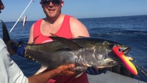 guest with nice tuna caught while on panama fishing vacation during dry season in panama