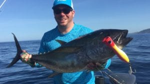 guest with tuna caught while visiting a panama fishing lodge during dry season