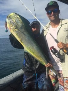 guy poses with dorado he caught while on panama fishing charter