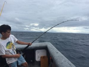 young angler hooked up while fishing in panama coiba island