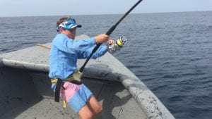 young guest fighting tuna while staying at panama fishing vacation