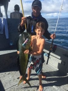 young kid catches dorado while on panama fishing vacation