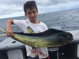young kid with his dorado catch fishing panama