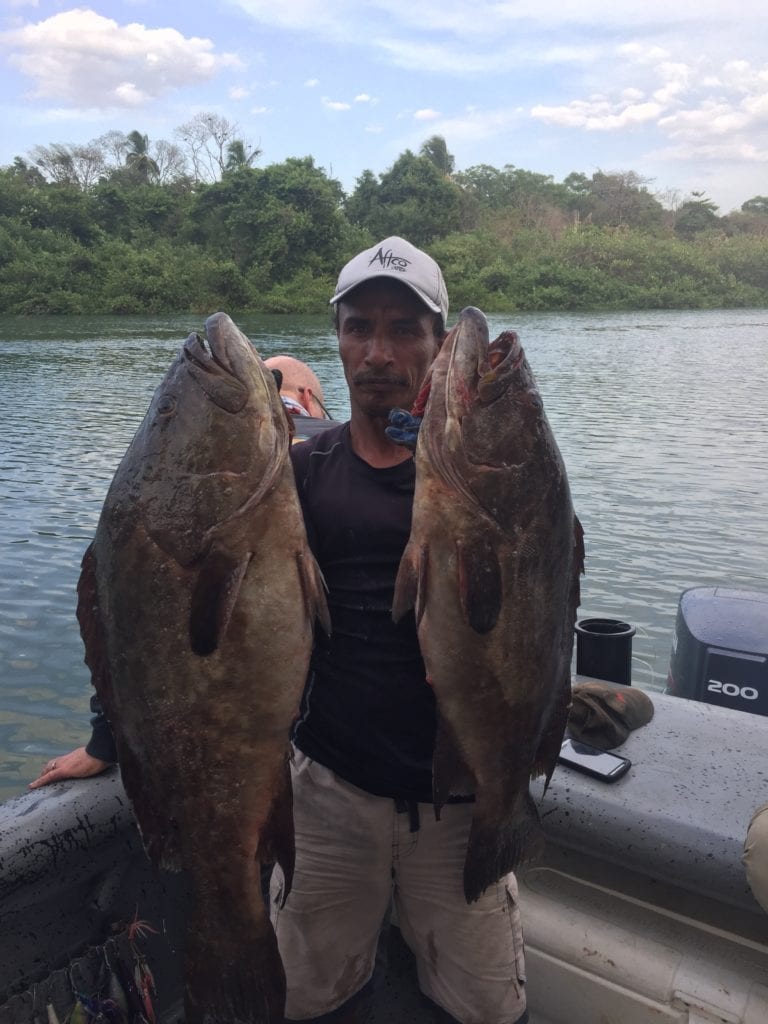 captain miguel with two grouper caught fishing cebaco island panama jigging