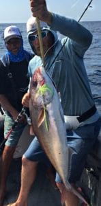 corey morris with small amberjack caught jigging with el rio negro