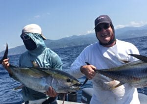 craig and corey morris with two foot ball sized tunas caught fishing panama
