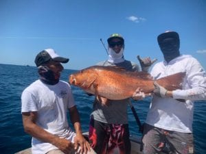 cubera snapper caught with friends on sport fishing charter in panama